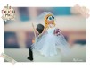 Figurine de tort pentru nunta - Mirele pescar este tras de guler de catre Mireasa 