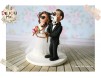 Figurine de tort pentru nunta - Mireasa il rapeste pe Mire care are pe gura banda adeziva pe care este scris "Yes"